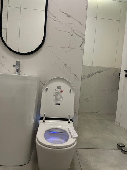 Smart toilet  Hola with buil-in tank, Geberit type frame with open lid in a bathroom setting www.hola.shop.pl