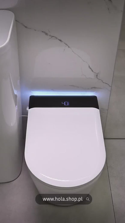Inteligentna toaleta klasy premium z wbudowanym zbiornikiem na wodę, stelażem ściennym, podgrzewanym siedziskiem , funkcją bidetu , osłoną antybakteryjną, aromaterapią, sterylizacja UV, automatyczne spłukiwanie , zdalne sterowanie ...